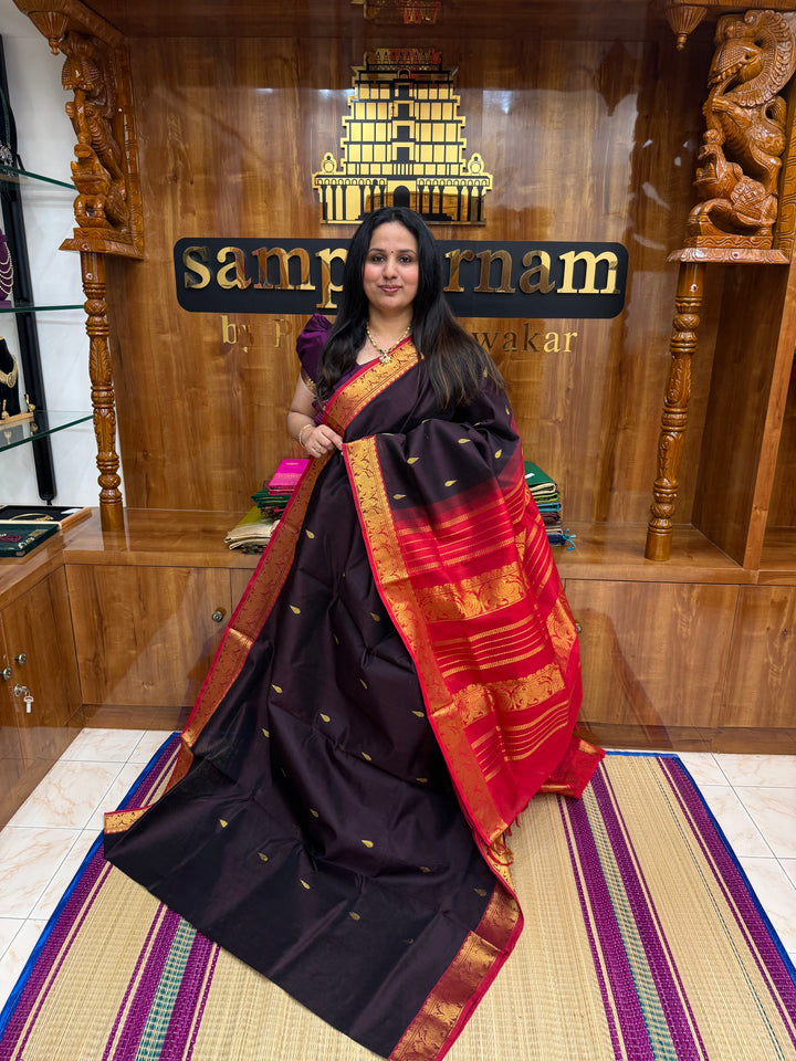 Dark Brown with Red  ,  Rich Tilakam Zari butta in the body , Traditonal Borders and  Rich Pallu Silk Cotton Saree