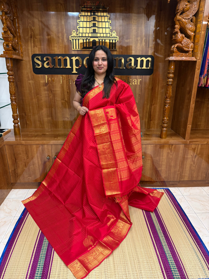 Classic Red with , Elegant Elephant Zari butta in the borders , Zari checks in the body and rich Pallu Silk Cotton Saree