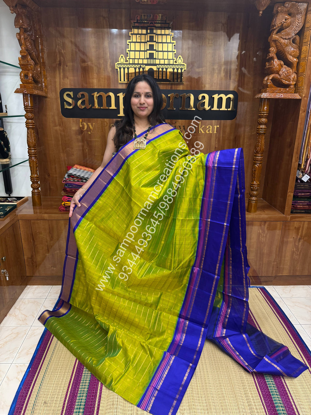 Sneha Green with Blue , rich Zari checks and butta  in the body with Rettapet Border and Grand Pallu Korvai Silk Cotton Saree
