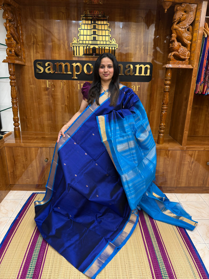 Dark Blue with Light Blue , Rich Floral Zari butta in the body , Traditional Borders and Rich Pallu Silk Cotton Saree