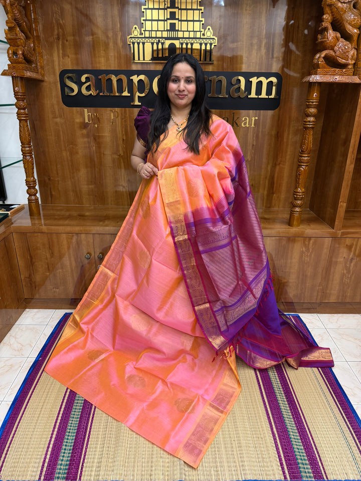 Peachish Pink with Magenta   ,  Rich Gandaberunda  Zari butta in the body , Traditional Borders and Rich Pallu Silk Cotton Saree