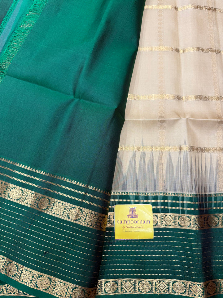 Ivory with Dark Green  , Rich Zari Checks in the body and Grand Pallu Pure Soft Silk Saree