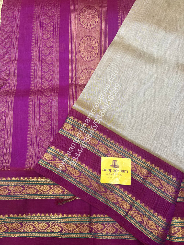 Dark Beige with Dark Magenta , rich Zari butta in the body , Rettapet border and Grand Pallu Korvai Silk Cotton Saree