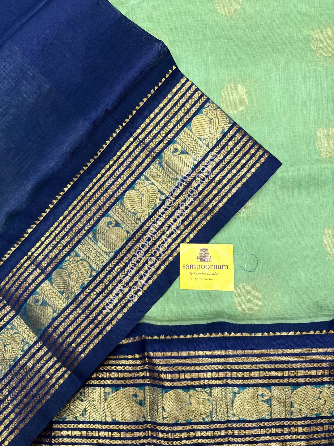 Pastel Green with Dark Blue  , Annam and Chakram Zari butta in the body , Rich Kanchi border , Grand Pallu Korvai Silk Cotton Saree