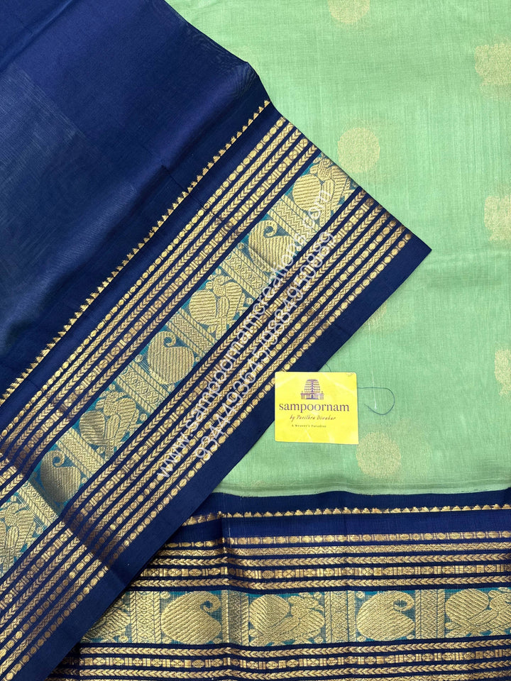Pastel Green with Dark Blue  , Annam and Chakram Zari butta in the body , Rich Kanchi border , Grand Pallu Korvai Silk Cotton Saree