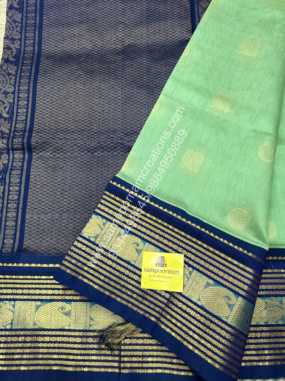 Pastel Green with Dark Blue  , Annam and Chakram Zari butta in the body , Rich Kanchi border , Grand Pallu Korvai Silk Cotton Saree