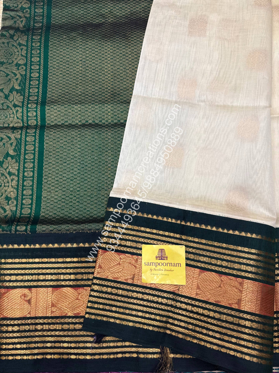 Cream with Dark Green  , Annam and Chakram Zari butta in the body , Rich Kanchi border , Grand Pallu Korvai Silk Cotton Saree , Annam and Chakram Zari butta in the body , Rich Kanchi border , Grand Pallu Korvai Silk Cotton Saree
