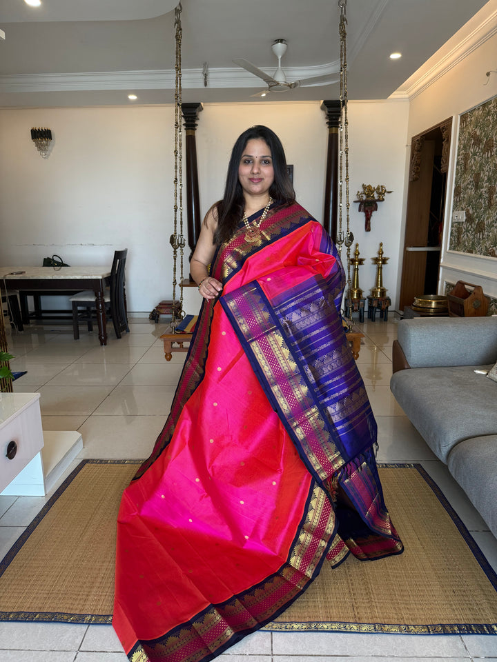 Magenta with Blue , rettapet border with Lakshadeepam butta , rich butta in the body and grand Pallu Korvai Silk Cotton Saree