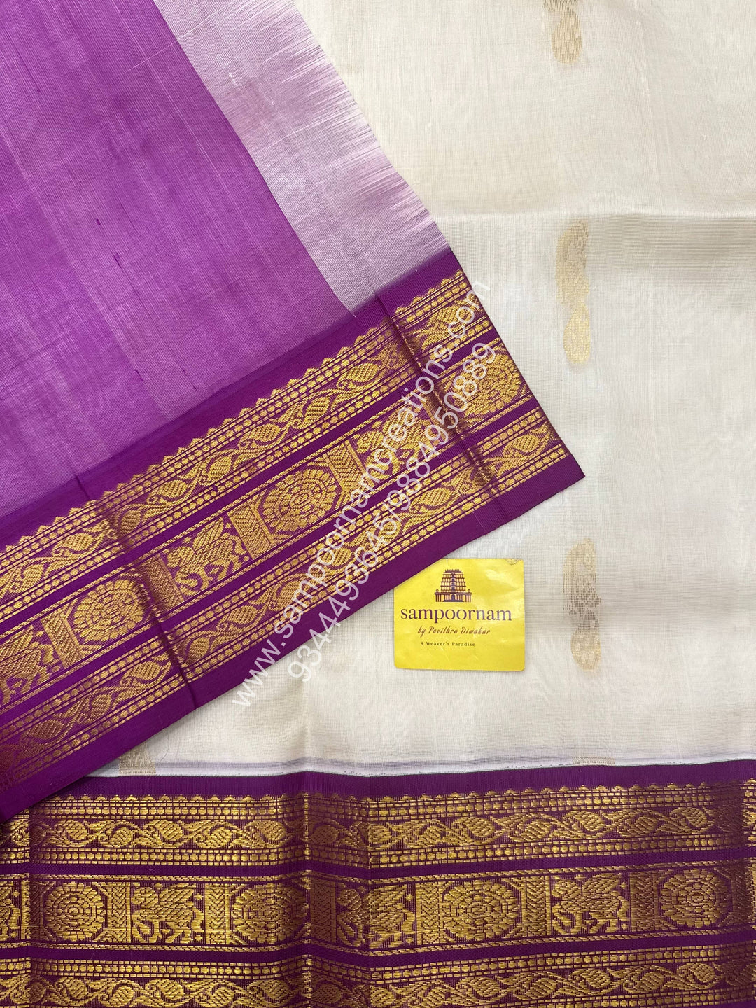 Offwhite with Dark Magenta , Mayil Zari butta in the body , traditional border and Grand Pallu Korvai Silk Cotton Saree