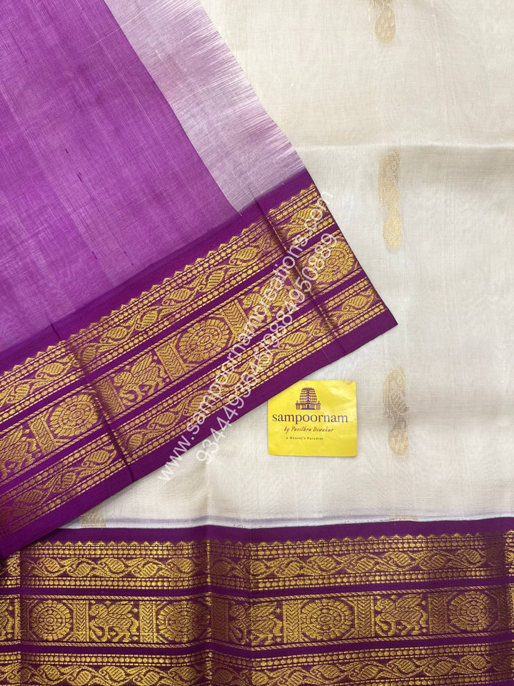 Offwhite with Dark Magenta , Mayil Zari butta in the body , traditional border and Grand Pallu Korvai Silk Cotton Saree