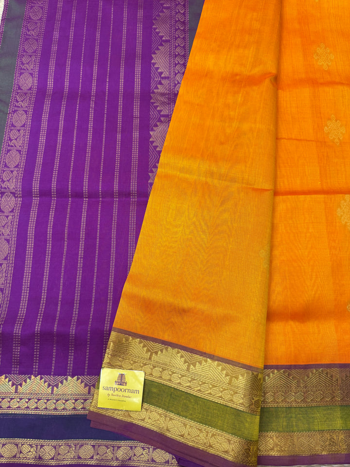 Orange with Magenta ,  Rich Kolam Zari butta in the body , Rettapet  Borders and Rich Pallu Silk Cotton Saree