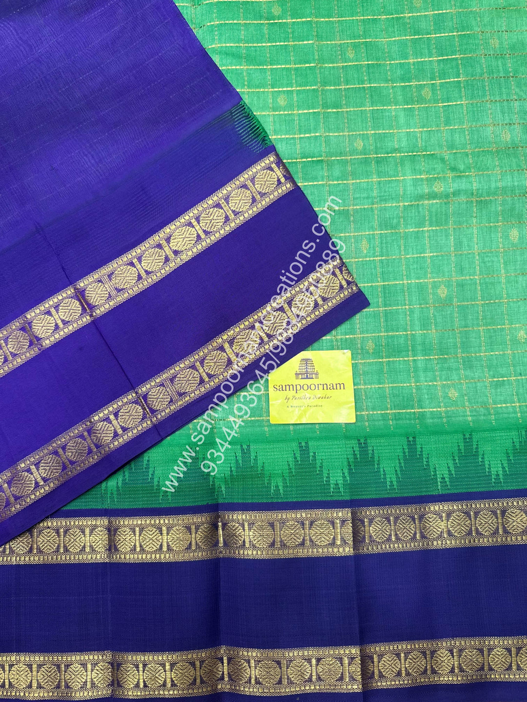 Elaichi Green with Blue , rich Zari checks in the body , Temple design with Rettapet Border and Grand Pallu Korvai Silk Cotton Saree
