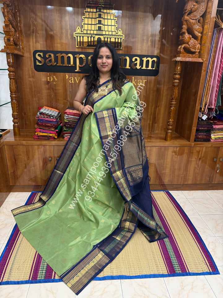 Pastel Green with Dark Blue  , Annam and Chakram Zari butta in the body , Rich Kanchi border , Grand Pallu Korvai Silk Cotton Saree