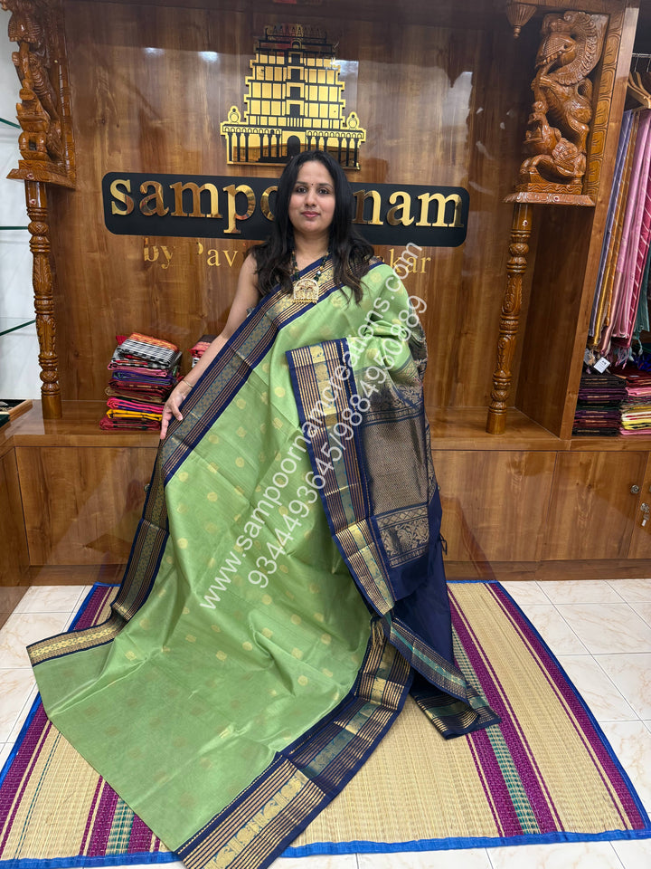 Pastel Green with Dark Blue  , Annam and Chakram Zari butta in the body , Rich Kanchi border , Grand Pallu Korvai Silk Cotton Saree