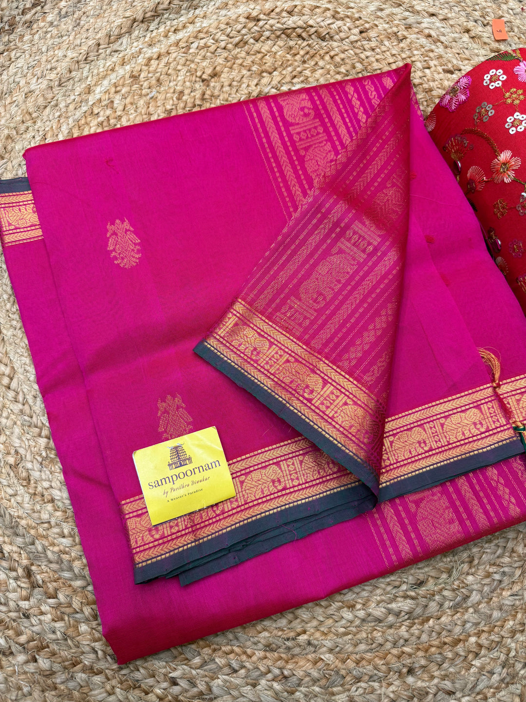 Rani Pink with Green Selvedge  ,  Rich Two Side Peacock  Zari butta in the body ,Traditional  Borders and Rich Pallu Silk Cotton Saree