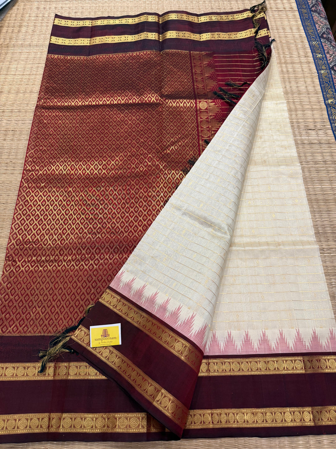Offwhite with Dark Maroon , traditional rettapet border ,Zari kattam in the body with Zari butta , rich Pallu  Korvai Silk Cotton Saree