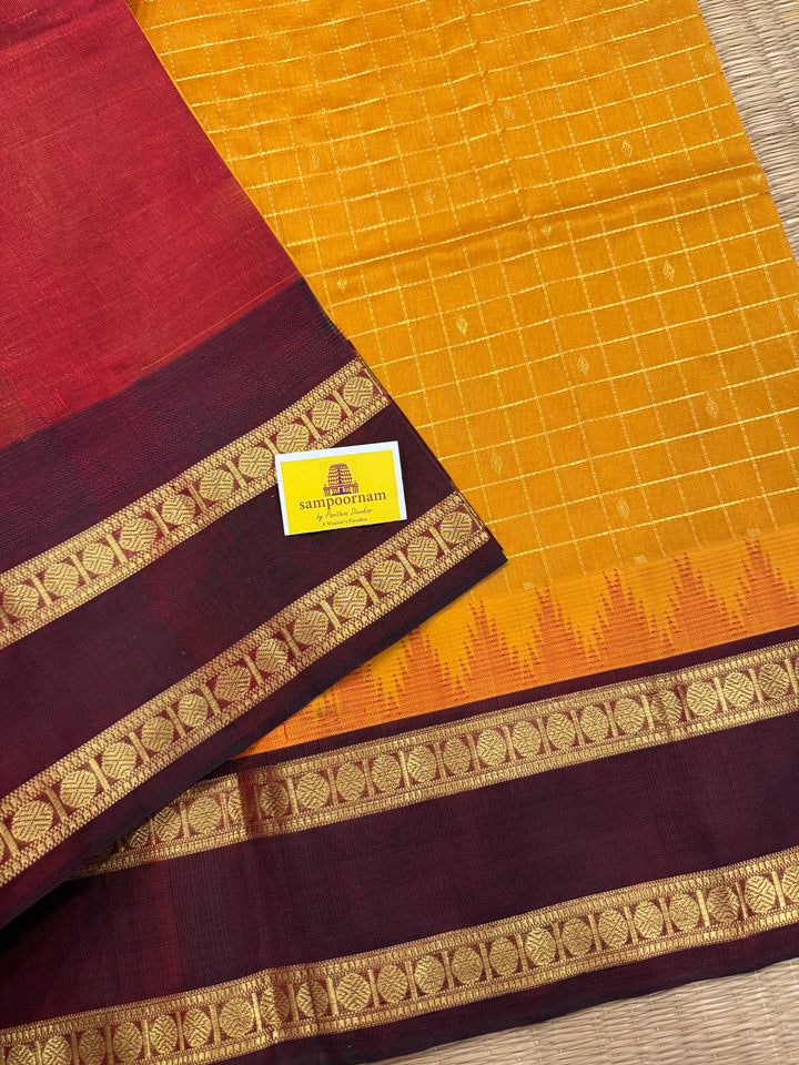 Manjal with Dark Maroon , traditional rettapet border , Zari kattam in the body with Zari butta , rich Pallu  Korvai Silk Cotton Saree