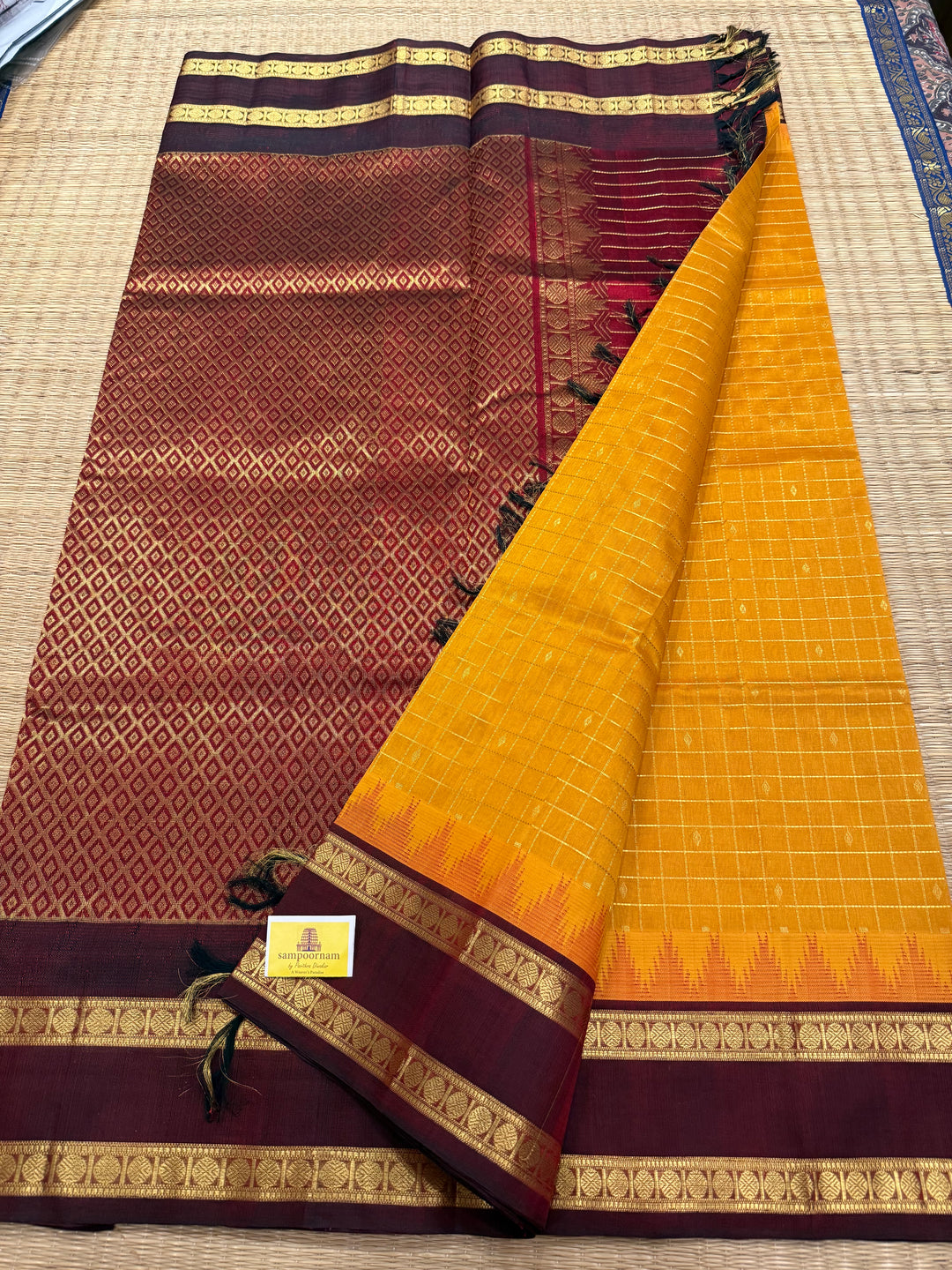 Manjal with Dark Maroon , traditional rettapet border , Zari kattam in the body with Zari butta , rich Pallu  Korvai Silk Cotton Saree