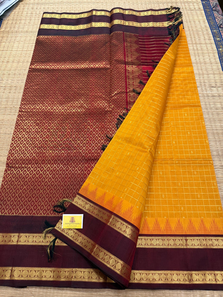 Manjal with Dark Maroon , traditional rettapet border , Zari kattam in the body with Zari butta , rich Pallu  Korvai Silk Cotton Saree
