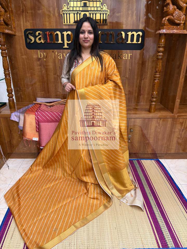 Mustard with Lehariya prints and small embroided mirror work in the body and border, tissue borders and pallu, VEGAN Saree