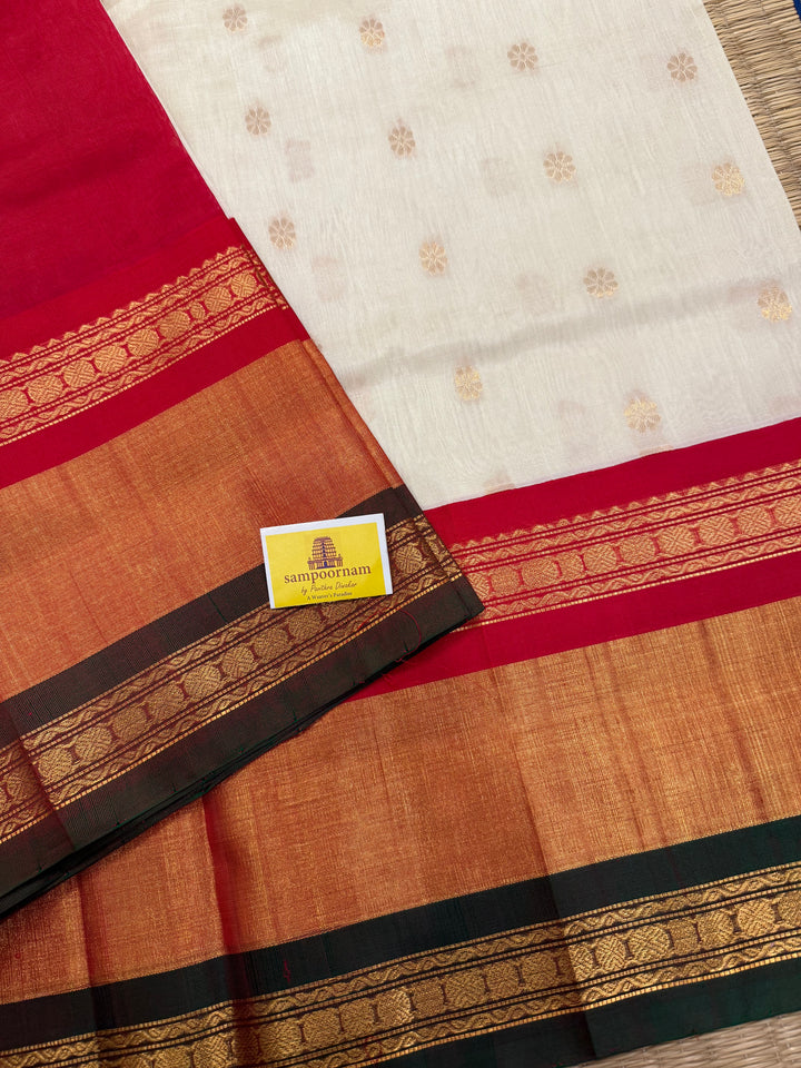 Offwhite with Red one side triple rich border in Red , Green and Gold , grand Pallu ,rich Zari butta in the body  Korvai Silk Cotton Saree