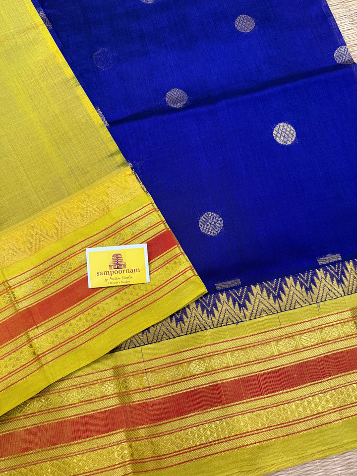 Dark Blue with Lemon Yellow , rich butta in the body , traditional borders and rich Pallu  Korvai Silk Cotton Saree
