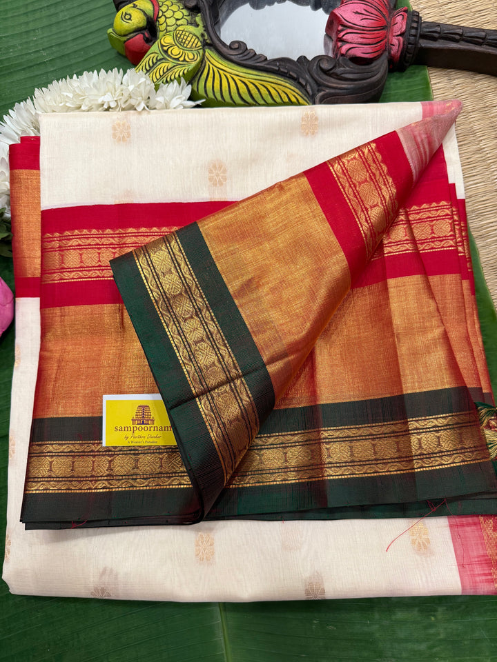 Offwhite with Red one side triple rich border in Red , Green and Gold , grand Pallu ,rich Zari butta in the body  Korvai Silk Cotton Saree