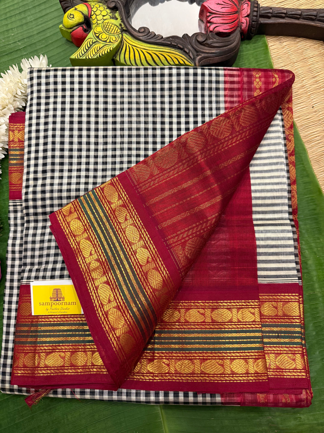 Black and White Podi Kattam with Red, traditional borders and rich Pallu Korvai Silk Cotton Saree