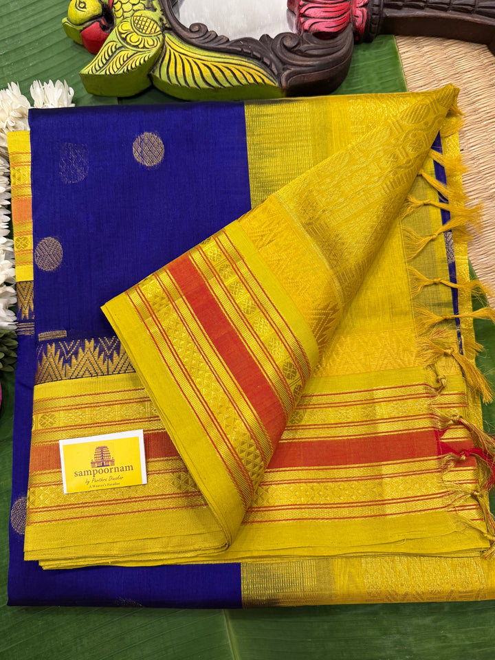 Dark Blue with Lemon Yellow , rich butta in the body , traditional borders and rich Pallu  Korvai Silk Cotton Saree