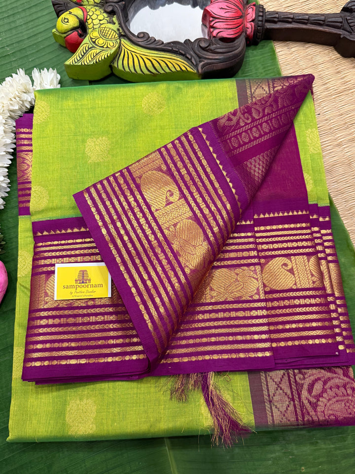 Parrot Green with Purple , rich Zari butta in the body , traditional rich Kanchi borders  and grand Pallu  Korvai Silk Cotton Saree