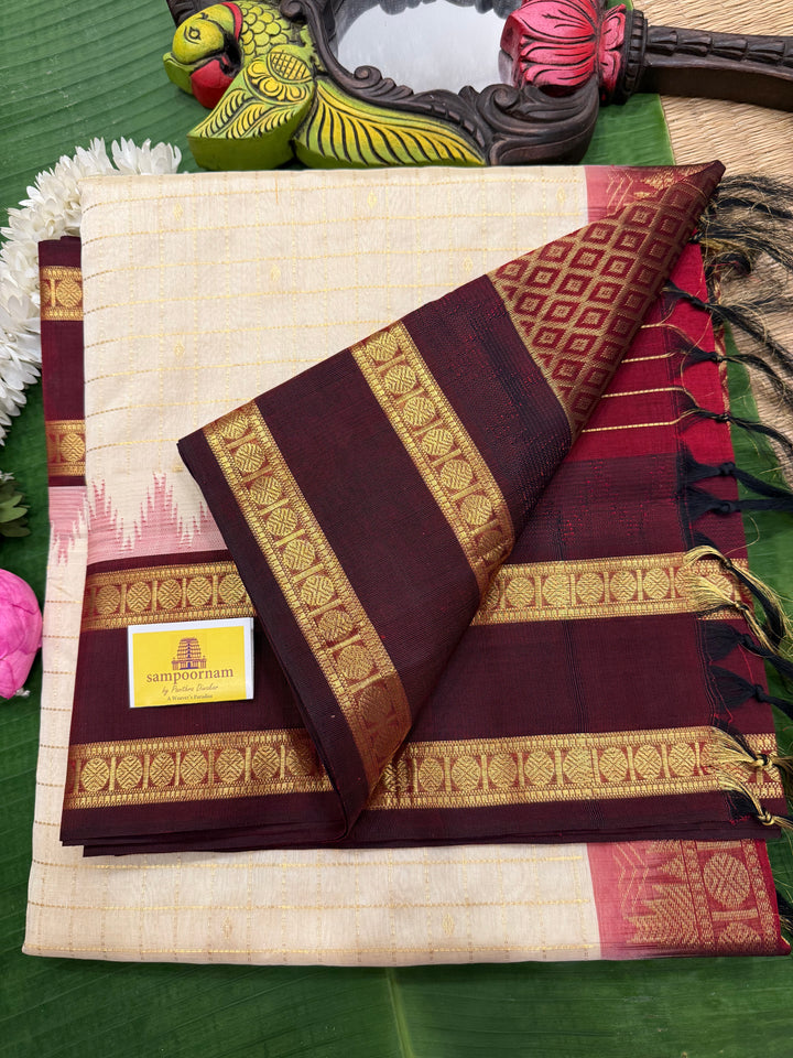 Offwhite with Dark Maroon , traditional rettapet border ,Zari kattam in the body with Zari butta , rich Pallu  Korvai Silk Cotton Saree