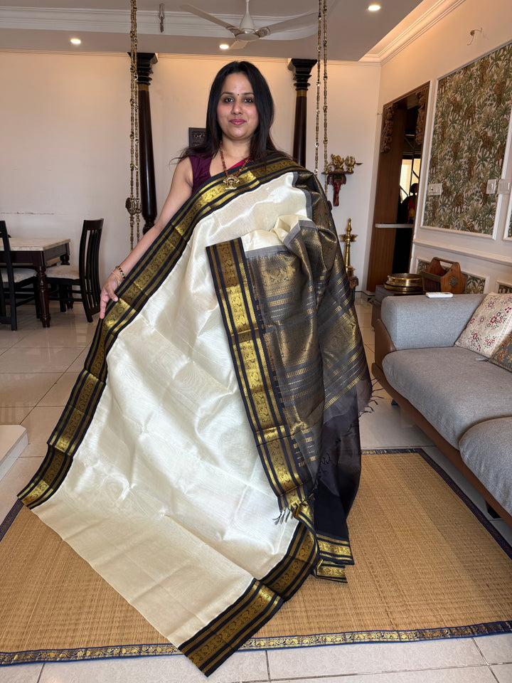 White with Black , traditional Kanchi borders  and rich Pallu  Korvai Silk Cotton Saree