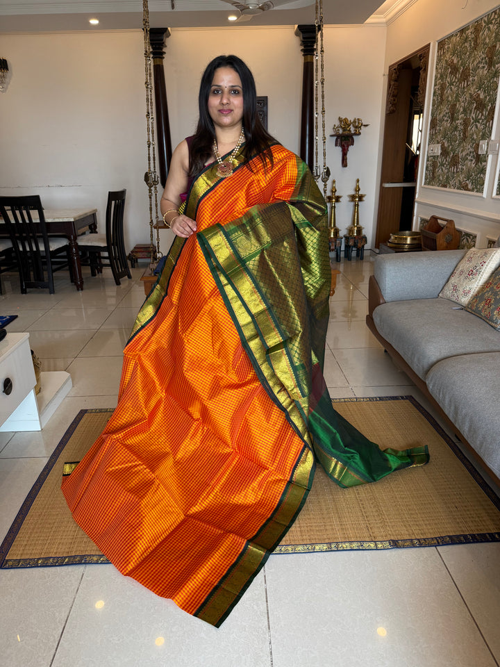 Manjal and Red Podi Kattam with Green , traditional borders and rich Pallu Korvai Silk Cotton Saree