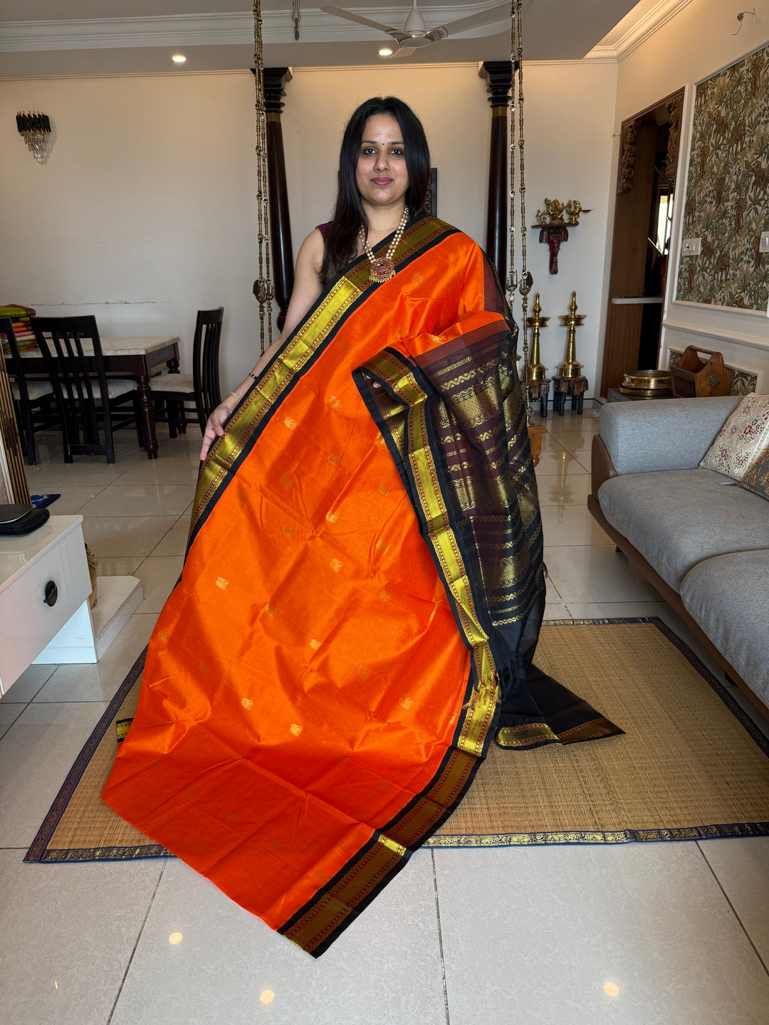 Orange with Black , rich elephant Zari motif in the body , traditional borders and rich Pallu  Korvai Silk Cotton Saree