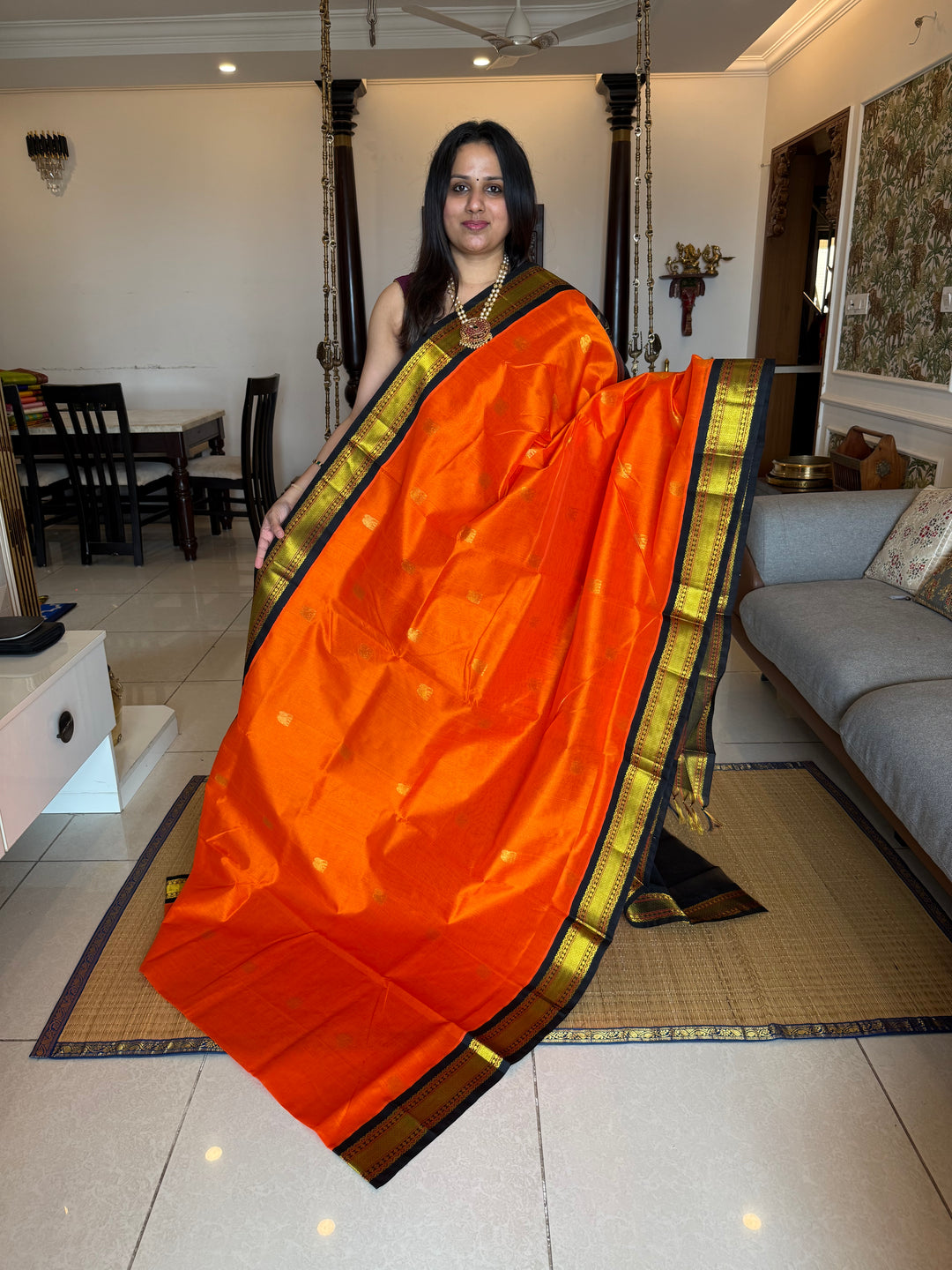 Orange with Black , rich elephant Zari motif in the body , traditional borders and rich Pallu  Korvai Silk Cotton Saree