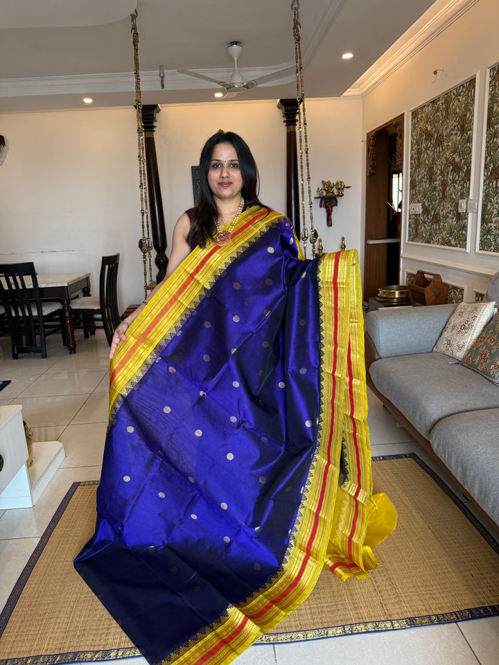 Dark Blue with Lemon Yellow , rich butta in the body , traditional borders and rich Pallu  Korvai Silk Cotton Saree