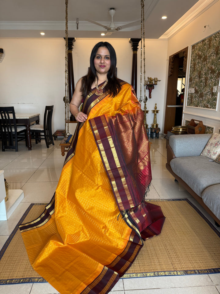 Manjal with Dark Maroon , traditional rettapet border , Zari kattam in the body with Zari butta , rich Pallu  Korvai Silk Cotton Saree