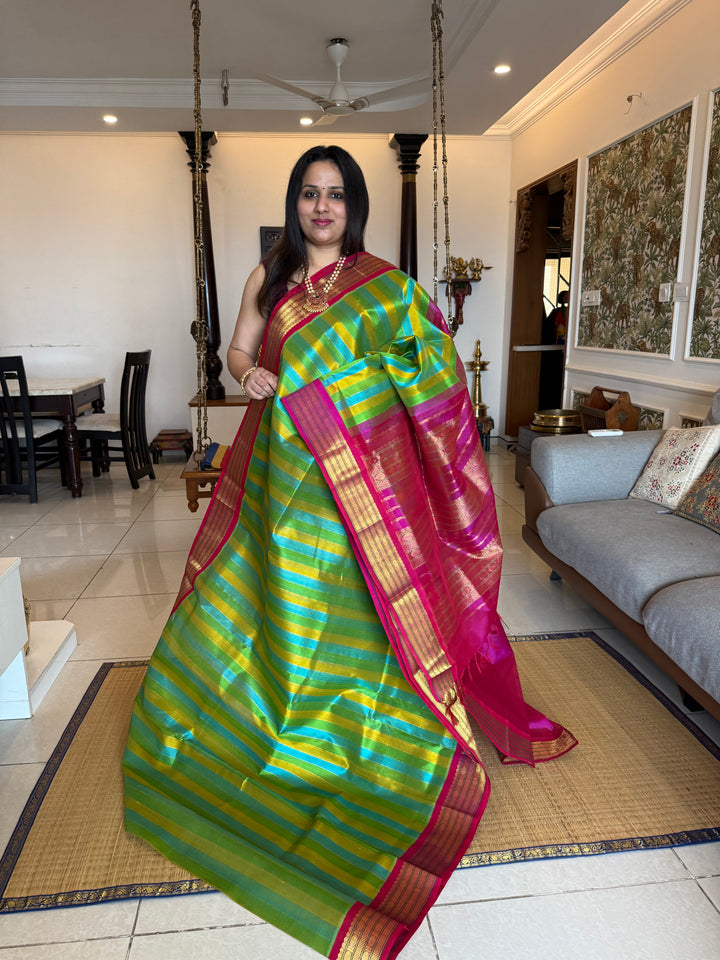 A Fusion of colours Yellow ,Turquoise Blue , Green with Magenta  , traditional borders and rich Pallu Korvai Silk Cotton Saree