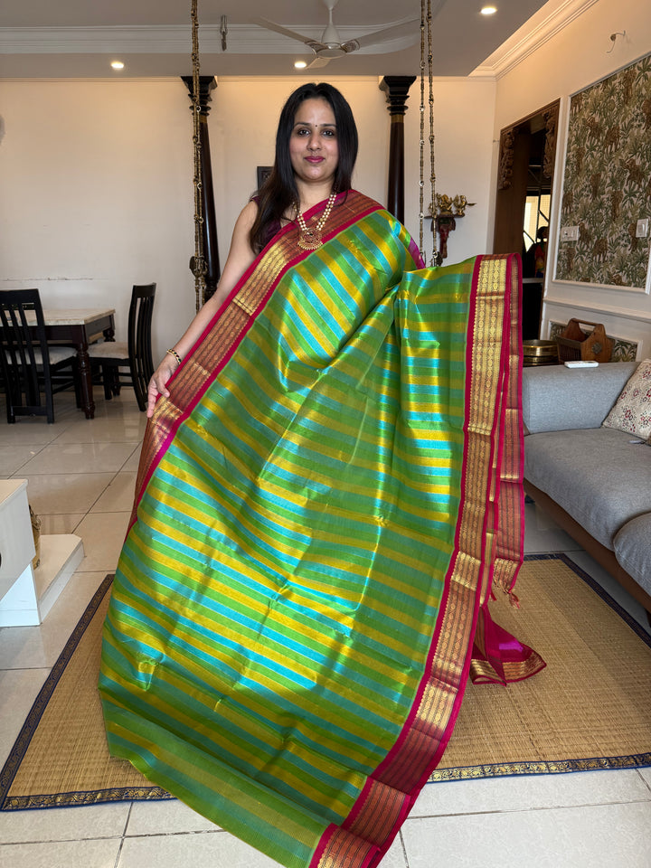 A Fusion of colours Yellow ,Turquoise Blue , Green with Magenta  , traditional borders and rich Pallu Korvai Silk Cotton Saree