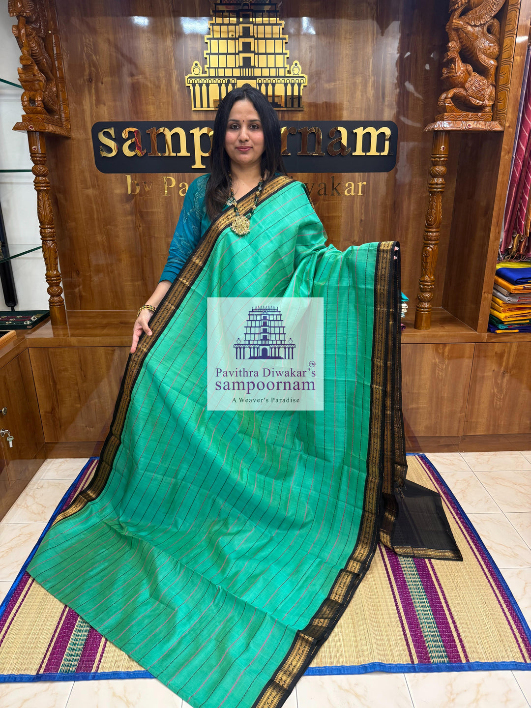 Ramar Green with Black  , traditional borders with Veldhari lines in the body and grand Pallu Korvai Silk Cotton Saree