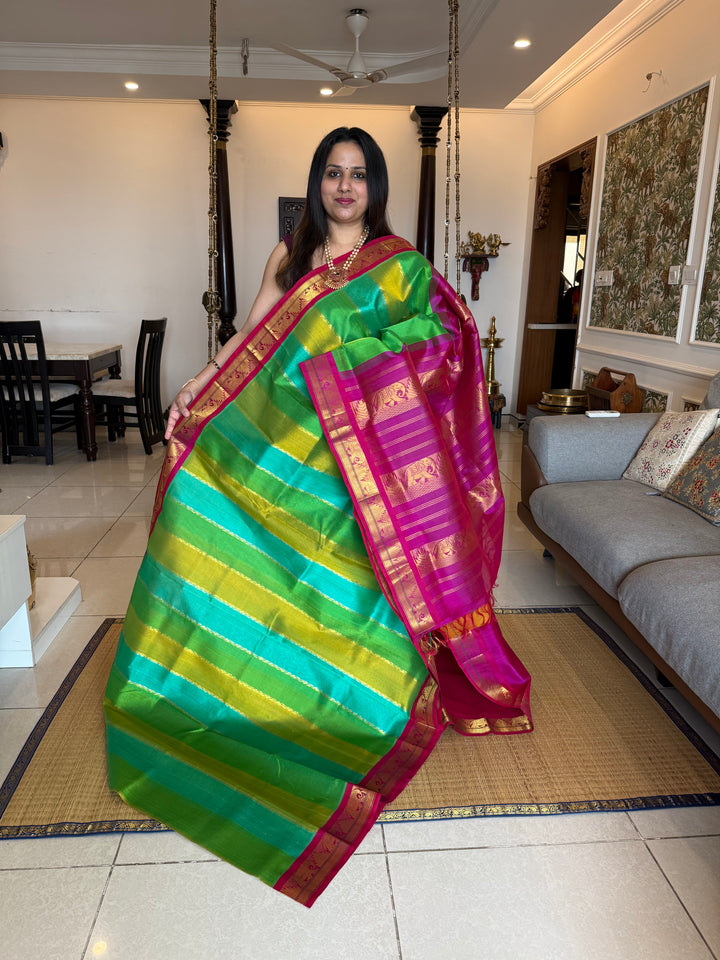 A Fusion of colours shades of Green and Blue with Magenta  , traditional borders and rich Pallu Korvai Silk Cotton Saree