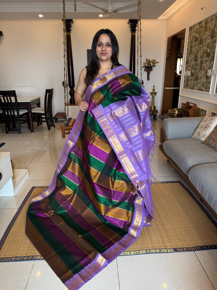A Fusion of colours Green , Purple and Vendhayam with Lavender , traditional borders and rich Pallu Korvai Silk Cotton Saree