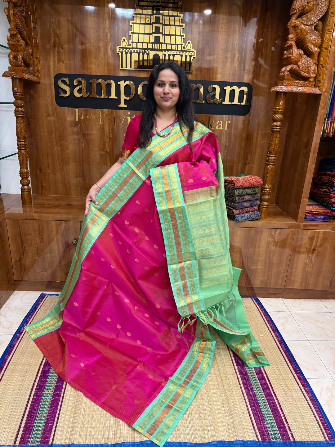 Rani Pink with Sea Green , Rich Zari checks and Butta in the body , Kanchi  borders and rich Pallu Korvai Silk Cotton Saree
