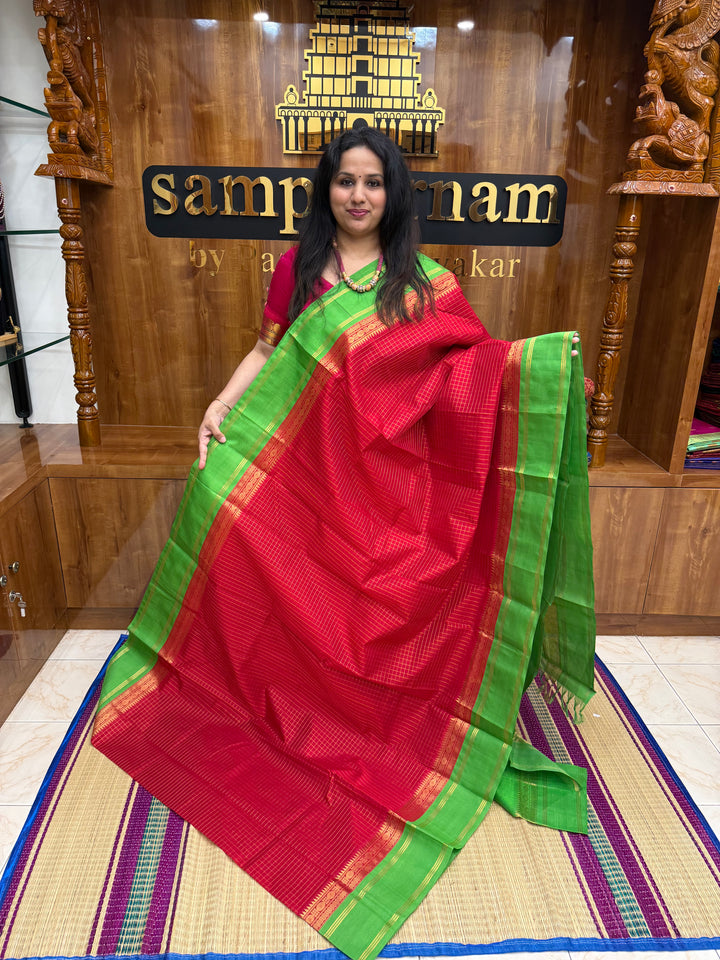 Red with Green , Rich Zari checks in the body , rettapet borders and rich Pallu Korvai Silk Cotton Saree