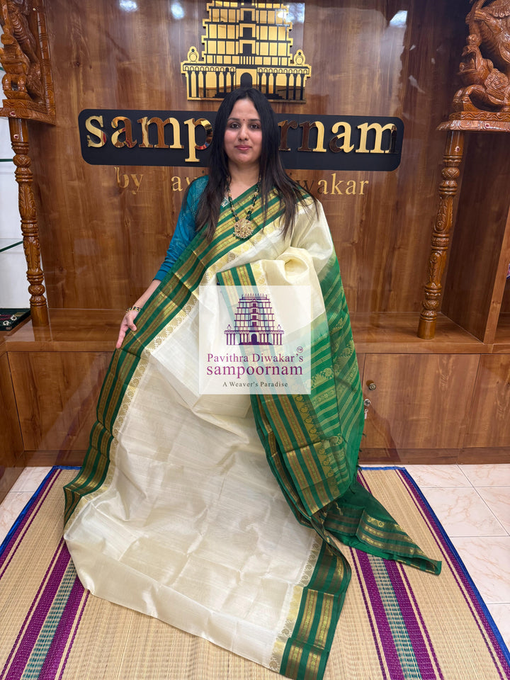 Offwhite with Green , Temple design with rettapet borders and rich Pallu Korvai Silk Cotton Saree