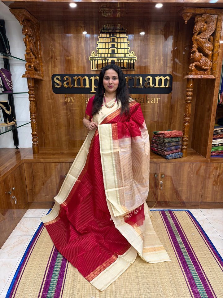 Classic Red with Offwhite , Rich Zari checks in the body , rettapet borders and rich Pallu Korvai Silk Cotton Saree