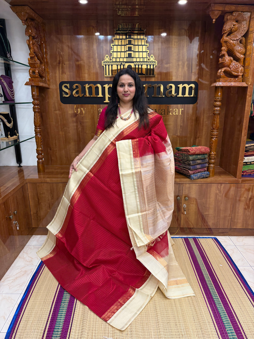 Classic Red with Offwhite , Rich Zari checks in the body , rettapet borders and rich Pallu Korvai Silk Cotton Saree