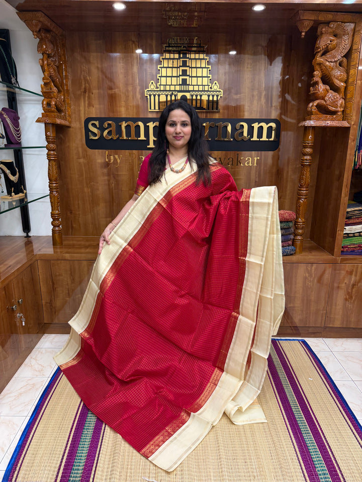 Classic Red with Offwhite , Rich Zari checks in the body , rettapet borders and rich Pallu Korvai Silk Cotton Saree