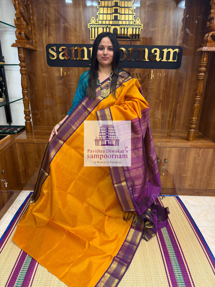 Manjal with Purple , rettapet borders and grand Pallu Korvai Silk Cotton Saree.