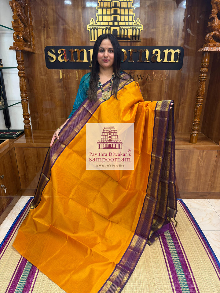 Manjal with Purple , rettapet borders and grand Pallu Korvai Silk Cotton Saree.